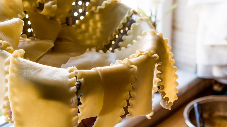 Precooked lasagna noodles in a colander