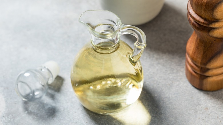Glass pitcher containing white wine vinegar