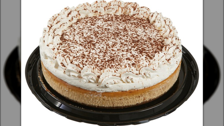 Costco tiramisu cheesecake in package on a white background