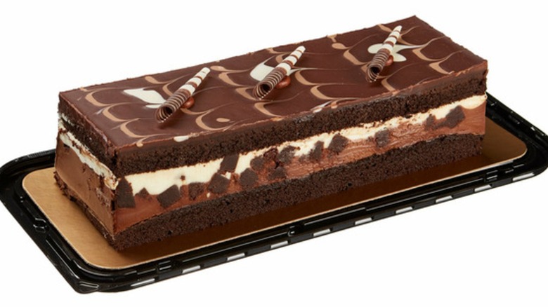 A Costco tuxedo chocolate mousse cake on a tray against a white background.