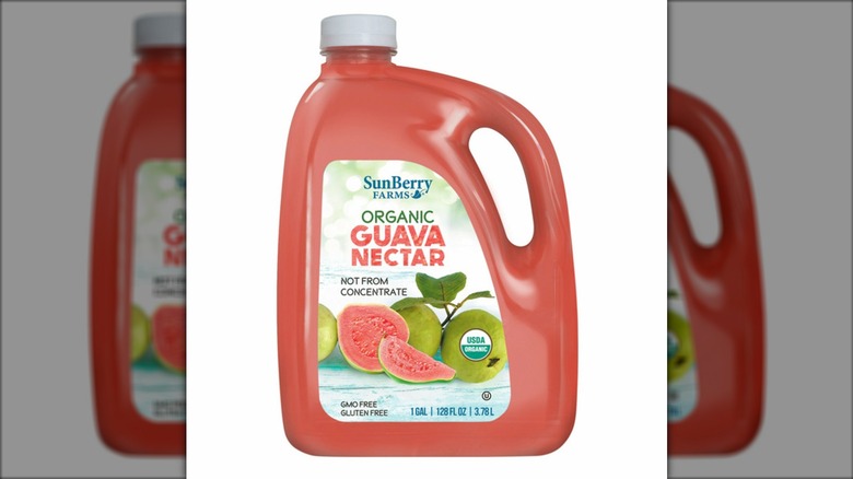 A jug of SunBerry Farms Organic Guava Nectar on a white background.
