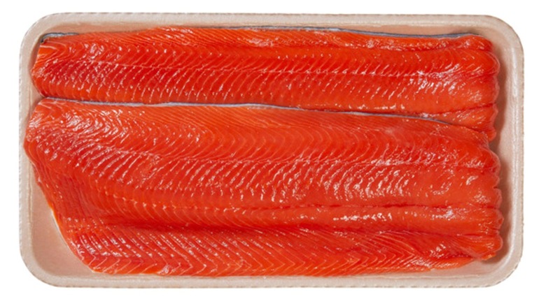 Package of Fresh Wild Sockeye Salmon Fillet on white background