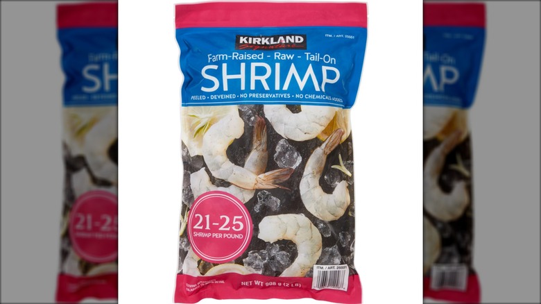 Bag of Kirkland Signature Farm-Raised Raw Shrimp on white background