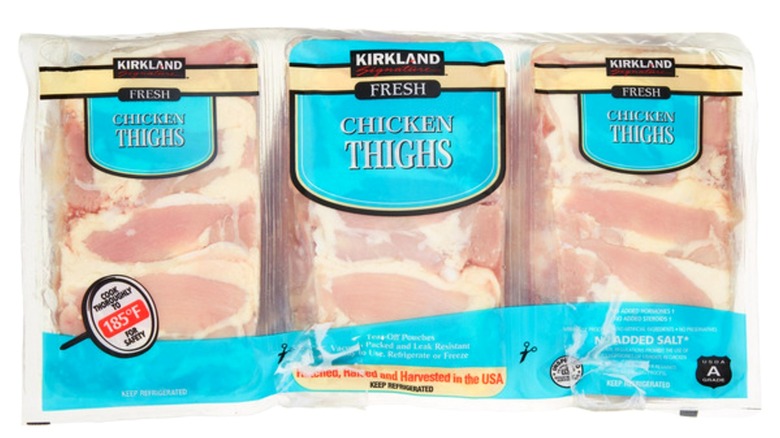 Three-pack of Kirkland Signature Fresh Chicken Thighs on white background