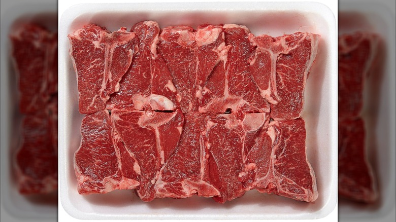 Package of Kirkland Signature Lamb Loin Chops on white background
