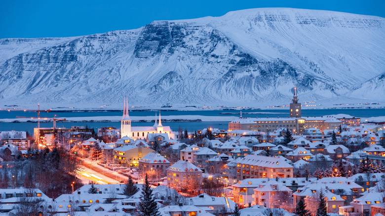 Snowy mountains in background of the city of Reykjavik, Iceland