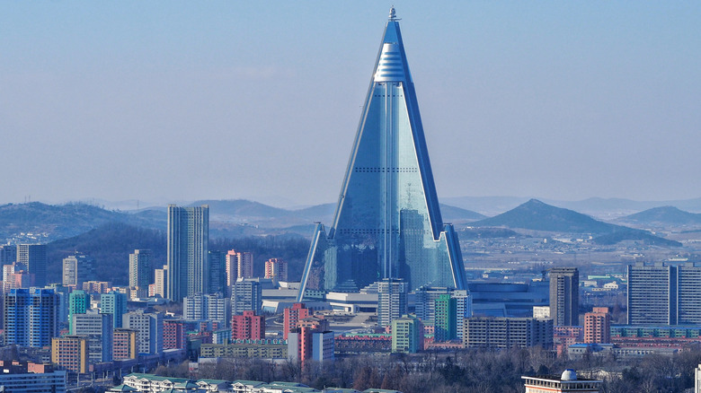 Pyramid-shaped skyscraper Hotel Ryugyong among city skyline in Pyongyang, North Korea