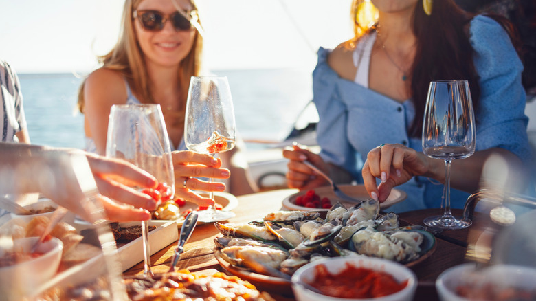 friends sharing a meal on a cruise ship