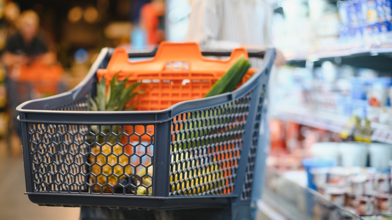 Shopping cart with products left in the aisle with no shopper