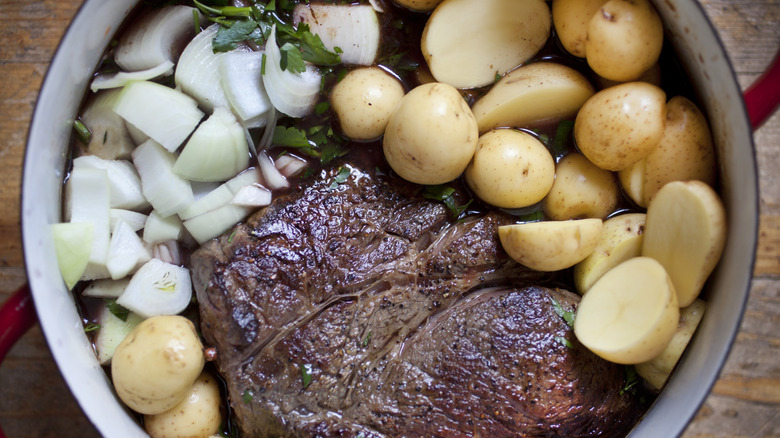 2 lbs of beef chuck roast seared on all sides, potatoes, onions, carrots, celery and parsley