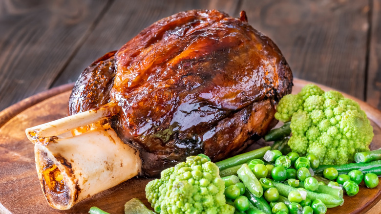 Cooked ham hock on the wooden cutting board