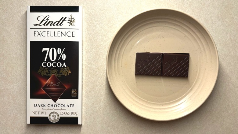 Lindt Excellence 70% Cocoa Dark Chocolate Candy Bar and chocolate on a plate