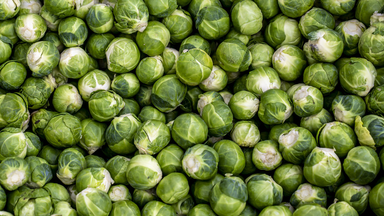 A birds eye view of a pile of brussel sprouts.
