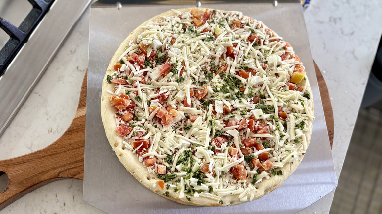 An unbaked DiGiorno margherita pizza