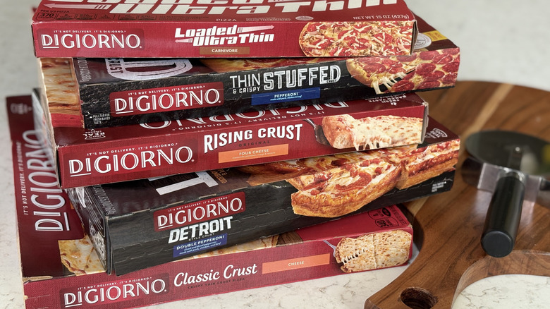 A stack of DiGiorno brand pizza boxes