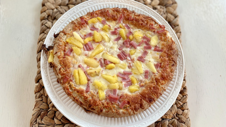 A DiGiorno rising crust Hawaiian pizza with Canadian bacon and pineapple toppings