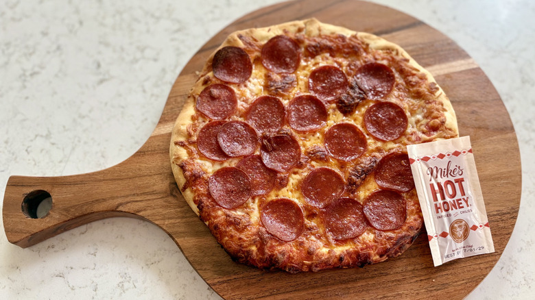 DiGiorno's thin and crispy stuffed crust pepperoni pizza with Mike's hot honey