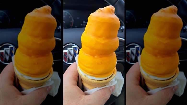 Hand holding a Dairy Queen Butterscotch Dipped Cone