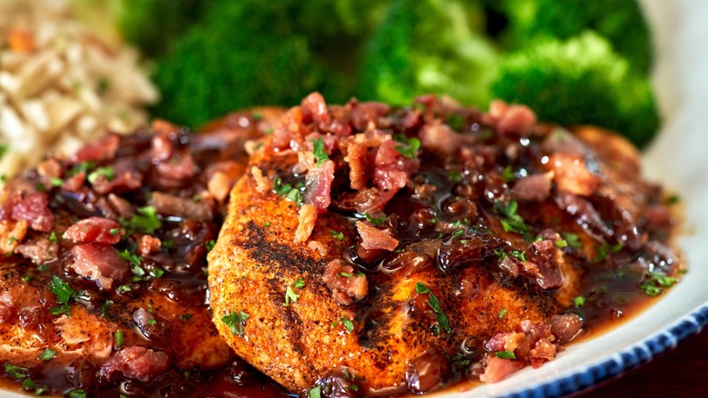 Red Lobster Maple Chicken plated with broccoli in the background