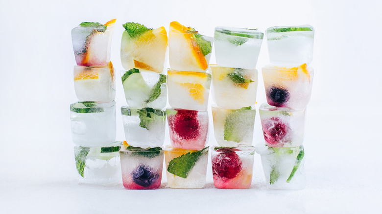 Fruit and herb-infused ice cubes stacked up