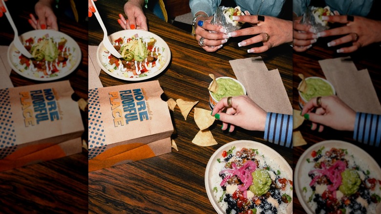 Hands of three people eating three Qdoba meals and sharing chips and guac