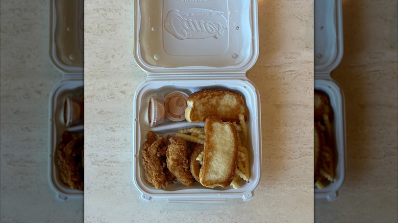 Raising Cane's meal with chicken, fries, and toast