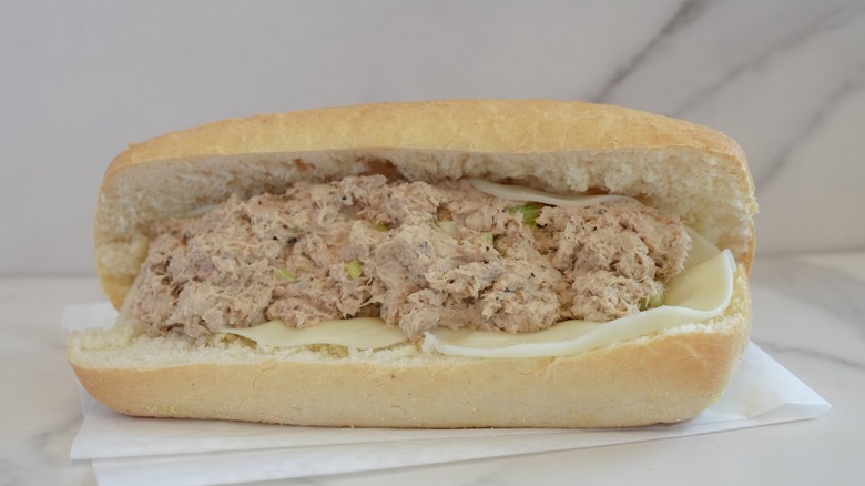 tuna salad sandwich on white marble background