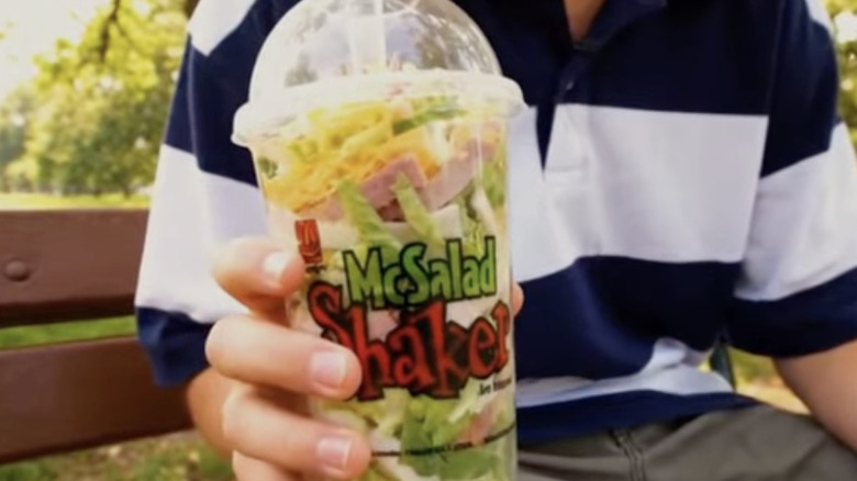 Boy's hand holding a McSalad Shaker