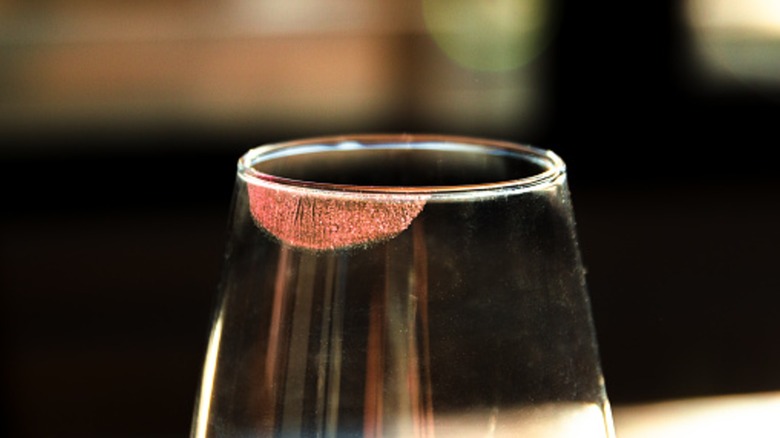 Wine glass with beautiful red lipstick print on it
