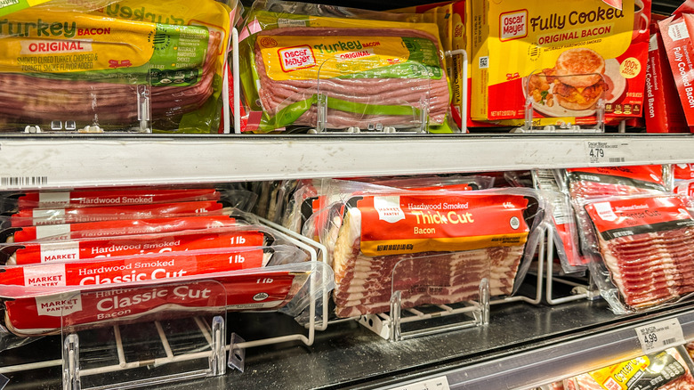 Bacon in packs on store shelf