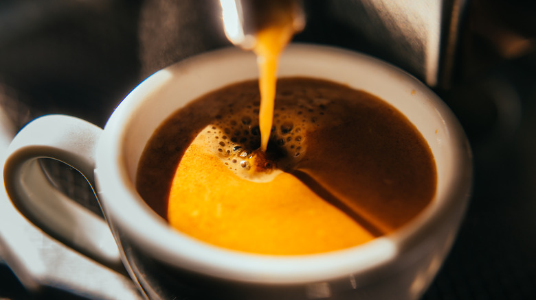 Close up cup of espresso being made