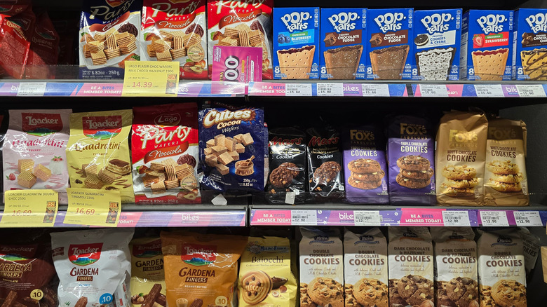 Wide selection of packaged cookies treats on grocery shelf