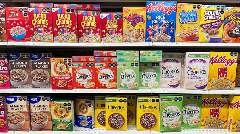 Colorful boxes of breakfast cereals on grocery store shelf