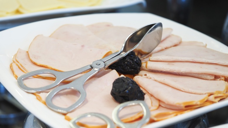 Sliced deli meats arranged neatly on a serving platter