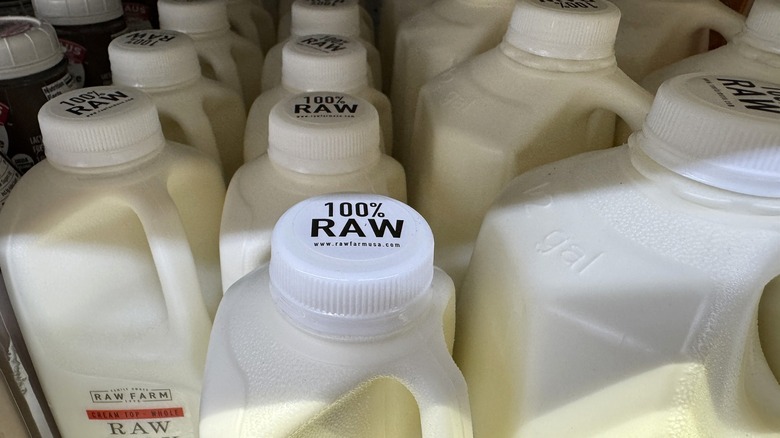 A close-up, overhead shot of cartons of 100% raw milk