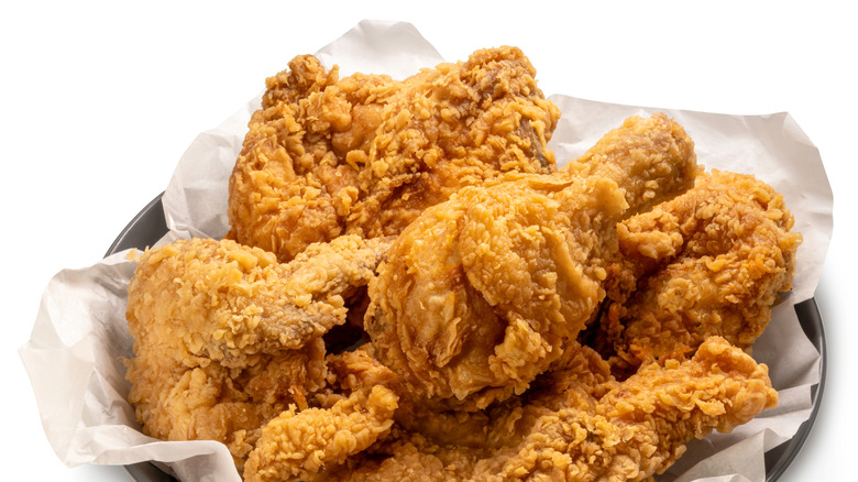 A bowl of assorted fried chicken pieces