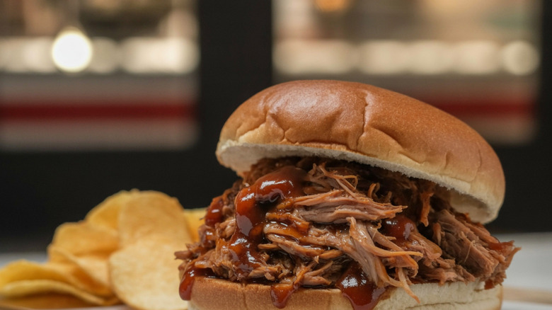 Pulled pork and barbecue sauce on a bun