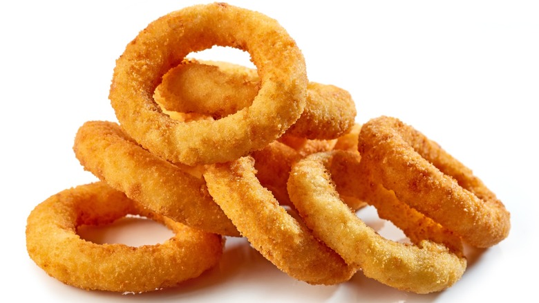 Stack of onion rings isolated on white background