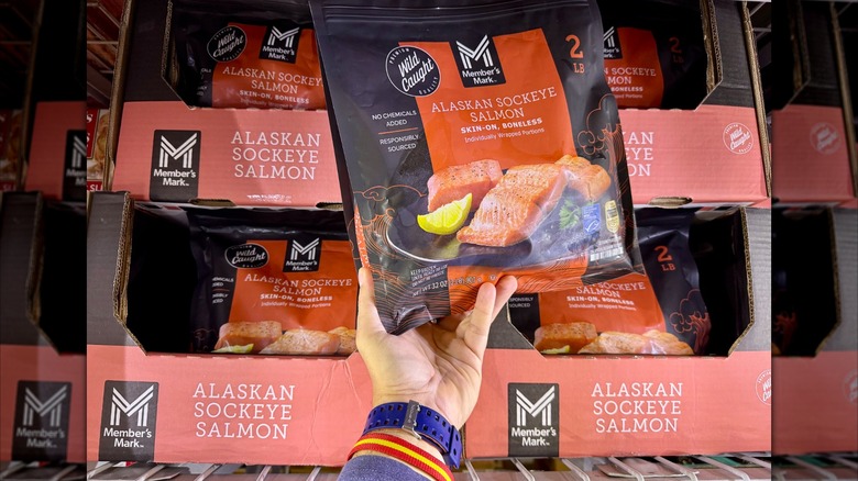 Hand holding bag of Member's Mark frozen salmon