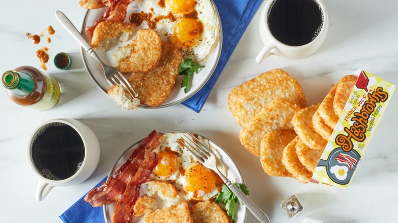 Trader Joe's Hashbrowns on two breakfast plates and also spilling from the packaging
