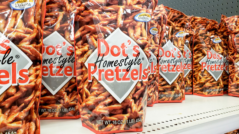 Bags of Dot's Homestyle Pretzels on a store shelf.