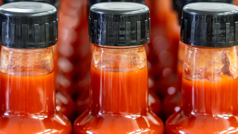 Close up of three bottles of hot sauce