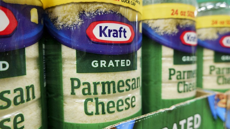 Bottles of Kraft grated parmesan cheese for sale on display