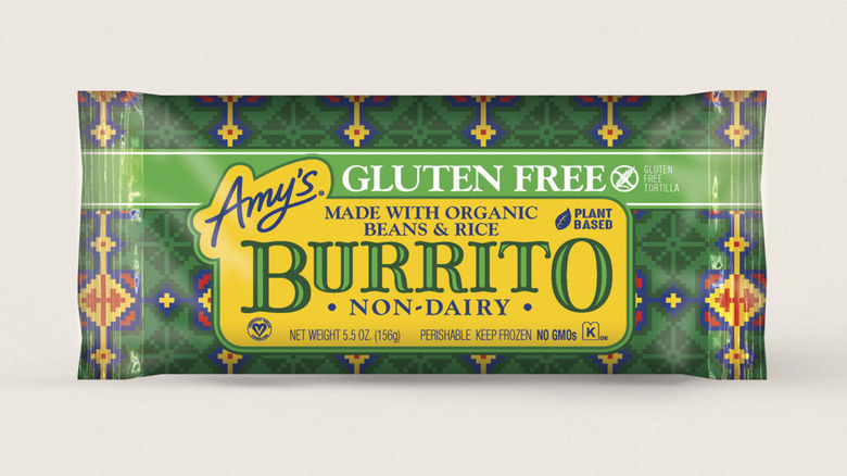 A stock photo of a green, blue and yellow package of Amy's gluten free non-dairy burrito