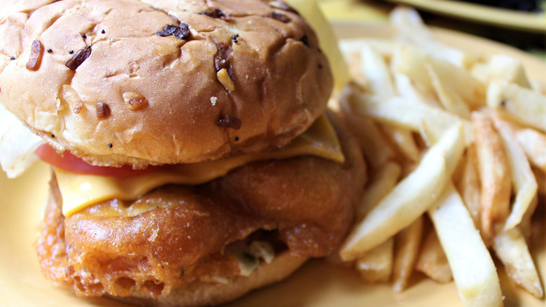 Fried grouper sandwich with a side of fries