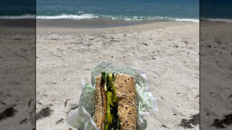 Publix sub sandwich in a wrapper at the beach in Florida