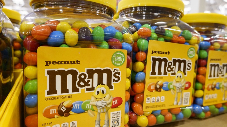 Plastic tubs of peanut M&M's