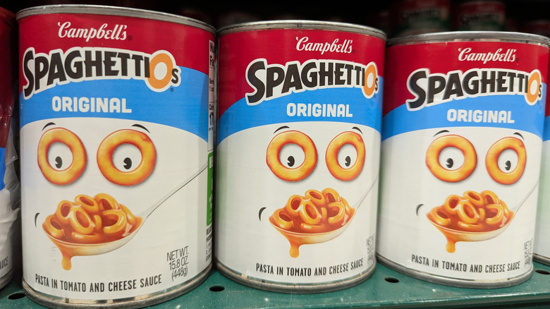 Three cans of SpaghettiOs on shelf