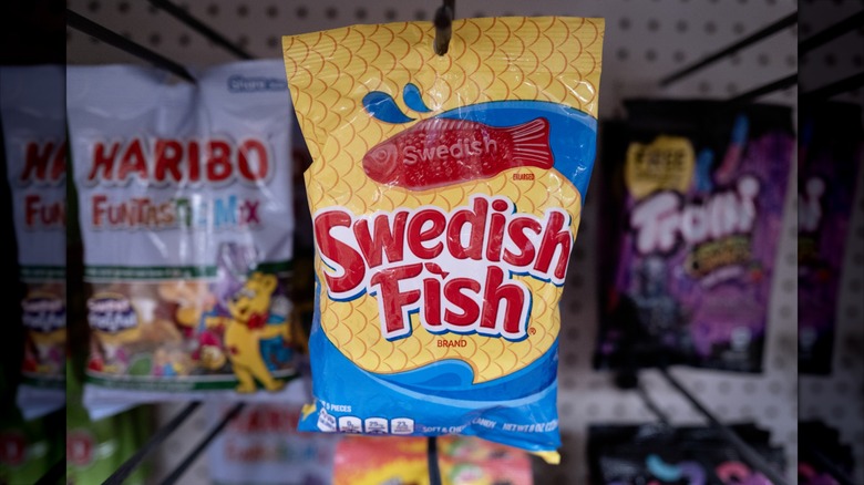 Bag of Swedish Fish hanging on candy display