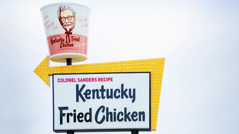 A photo of the white and yellow sign at the Sanders Café and Museum.